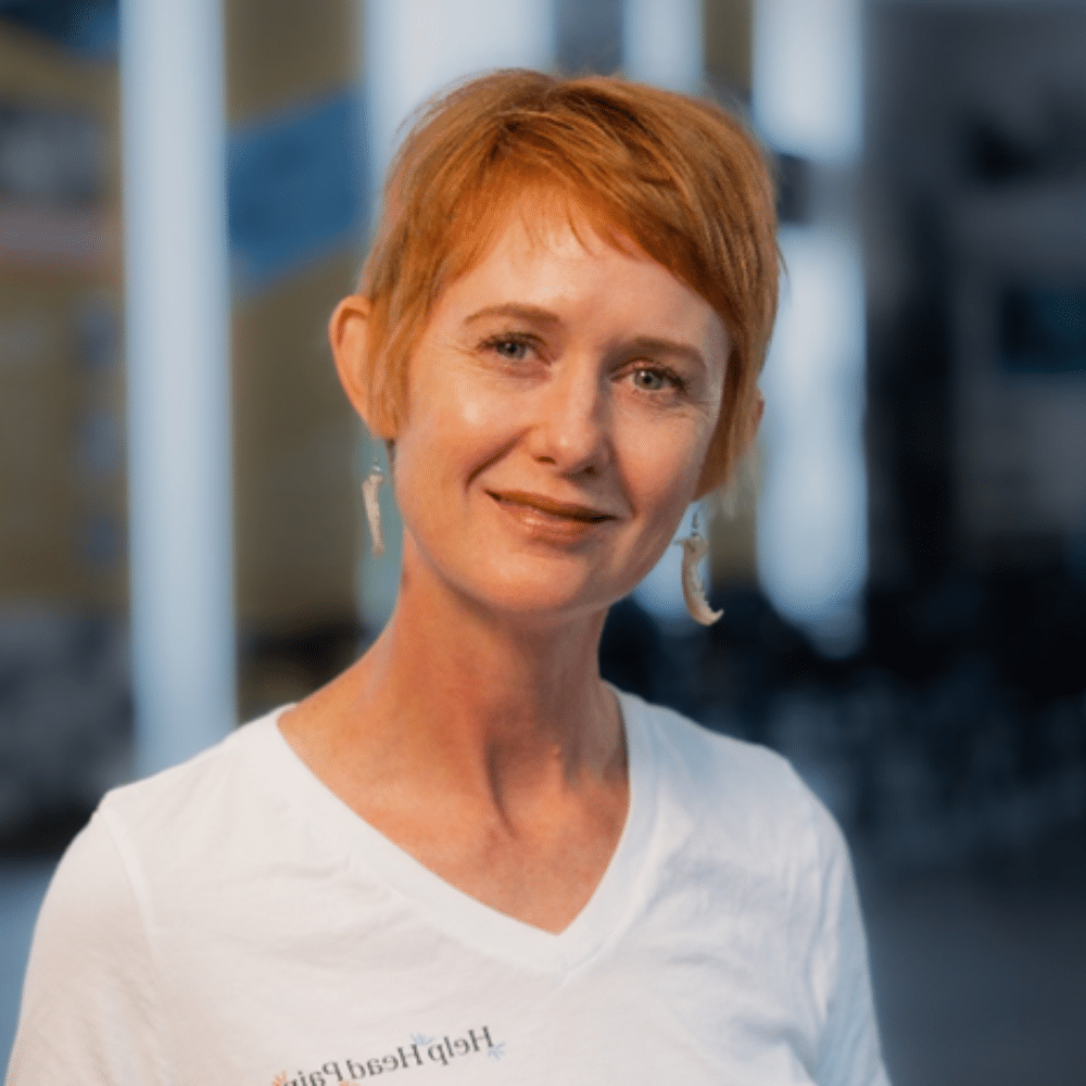 A person leaning on a railing Description automatically generated (1)