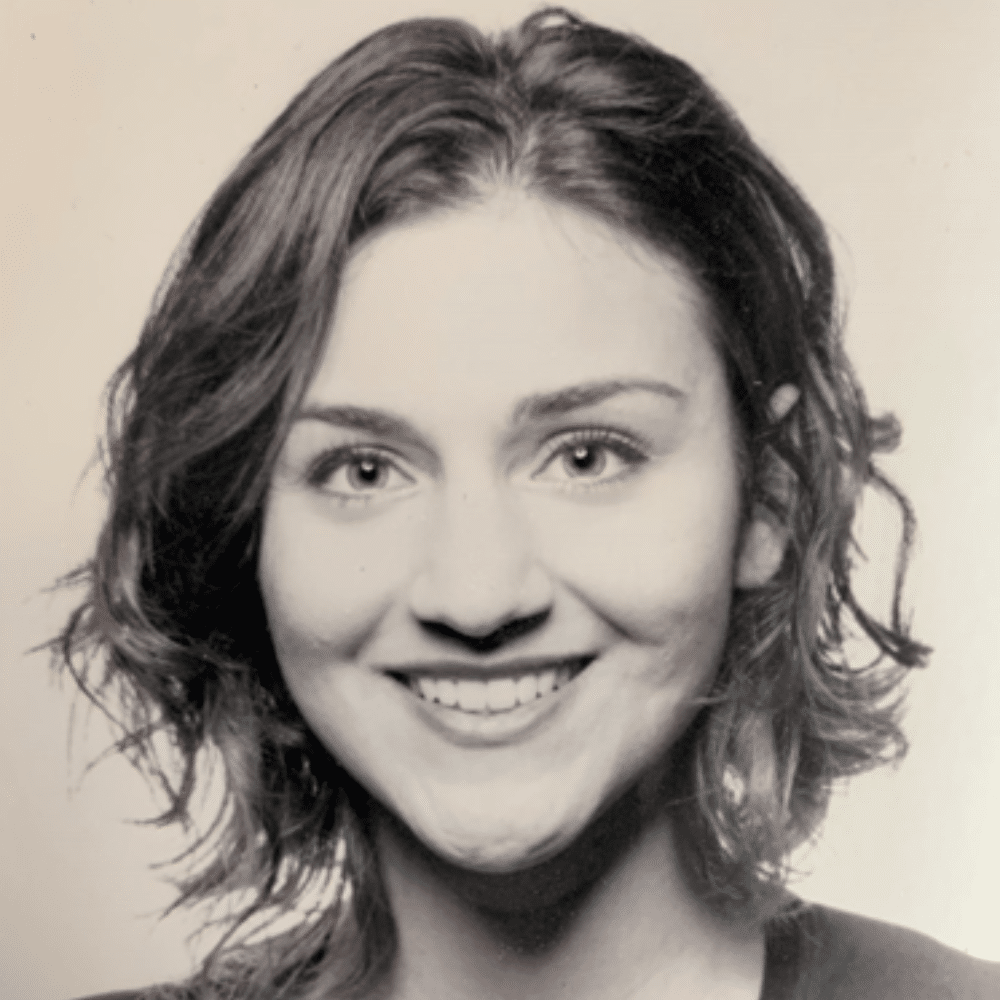 A person leaning on a railing Description automatically generated (2)